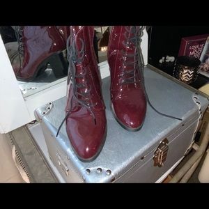 Wine colored shiny boots.